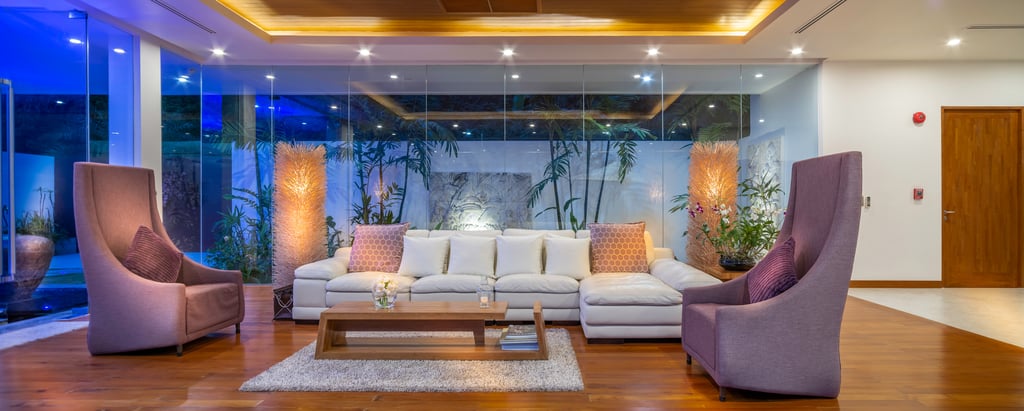 villa solaris lounge room and garden at night