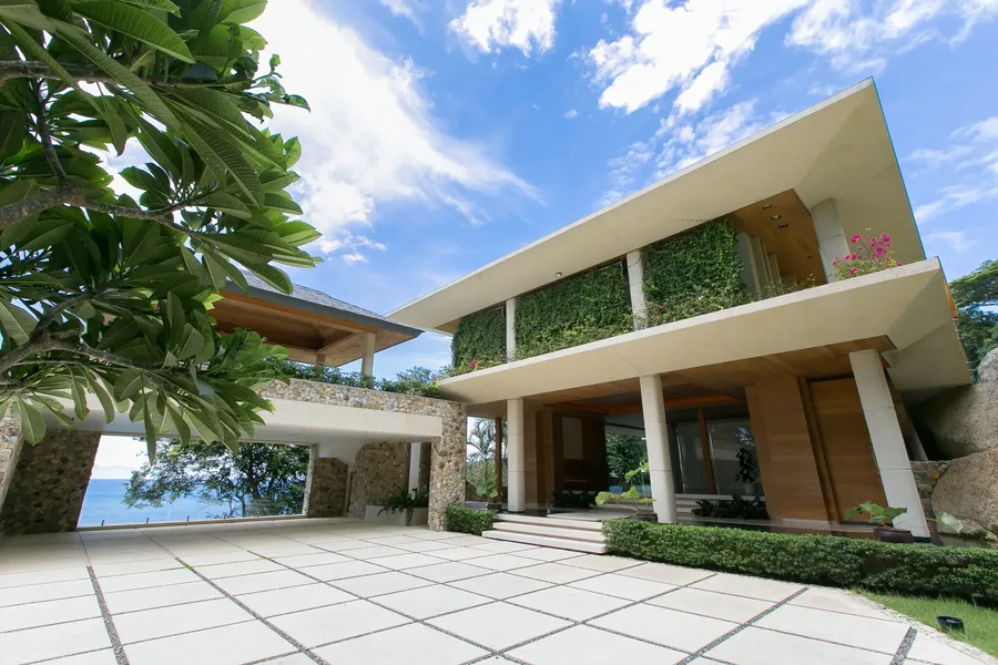 Arrival court with a glimpse of the sea beyond the porte-cochere