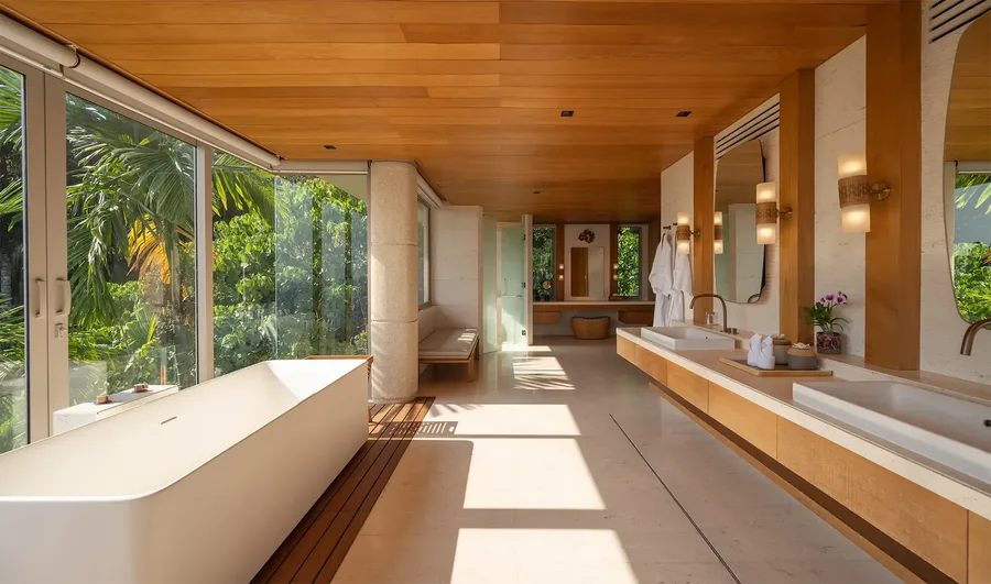 Master bathroom with bathtub and double vanity