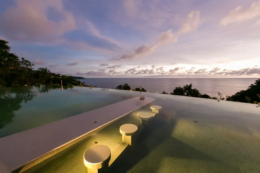 In-water seats in the pool at dusk