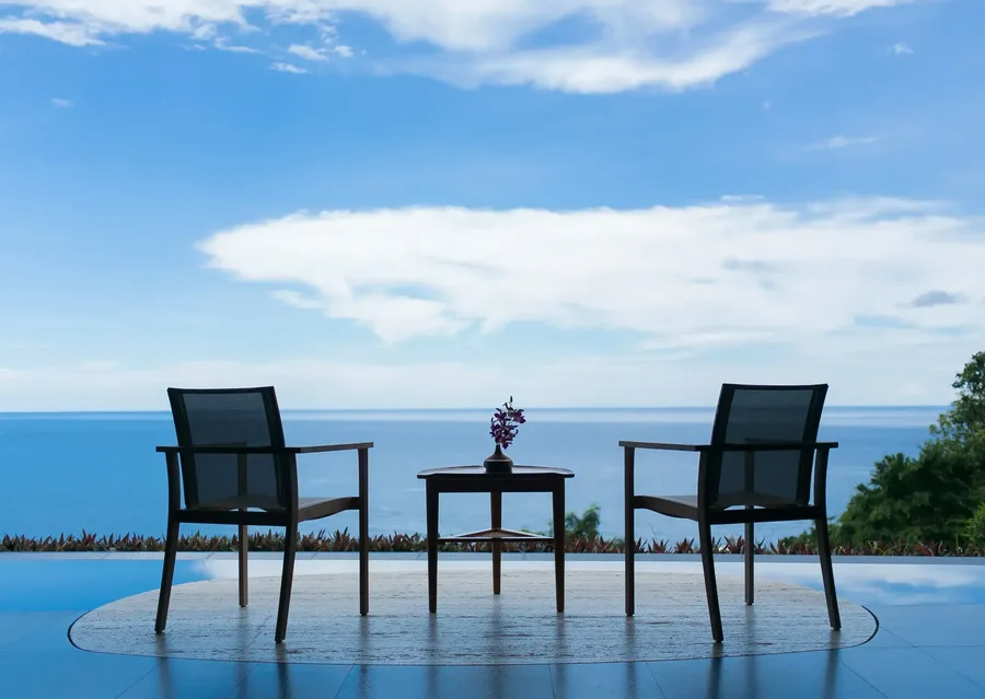 Terrace chairs facing the open sea
