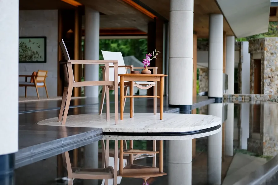 Terrace chairs on a reflecting pool