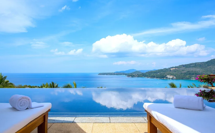Infinity pool edge with towels and the Andaman Sea, Villa Daran, Kamala, Phuket