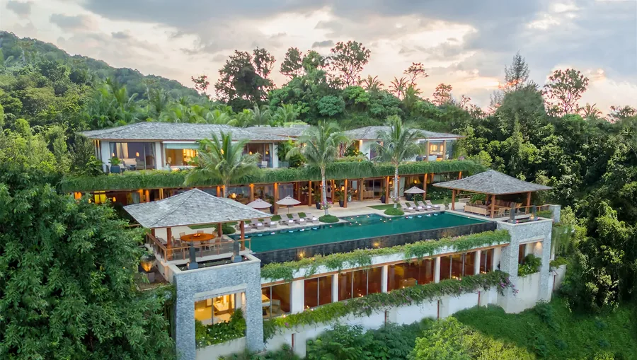 Aerial view of Villa Sawana, Kamala, Phuket, with its infinity pool and tropical gardens above the Andaman Sea